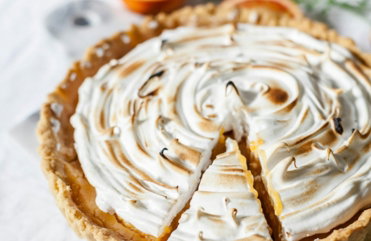 round sliced pie with cream